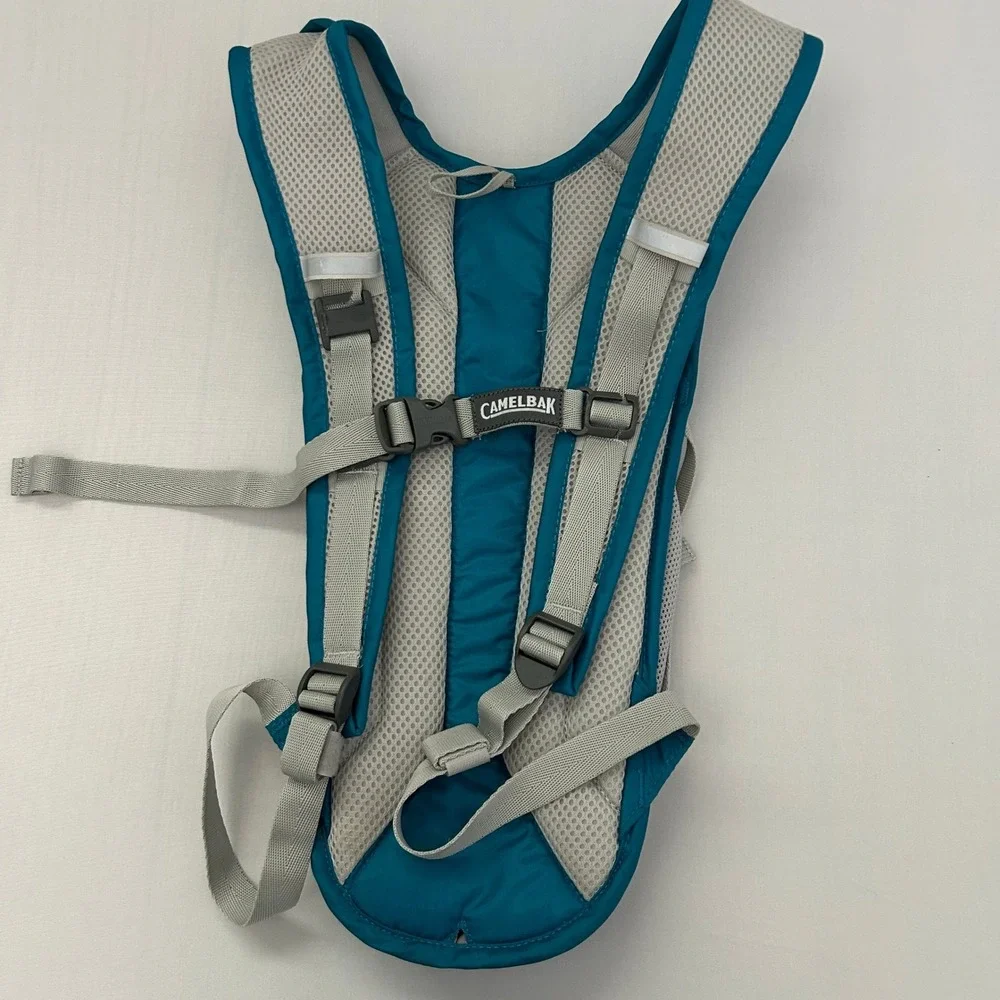 CamelBak Velocity Hydration Pack Teal Blue Reflective Hiking Running Bag 70oz